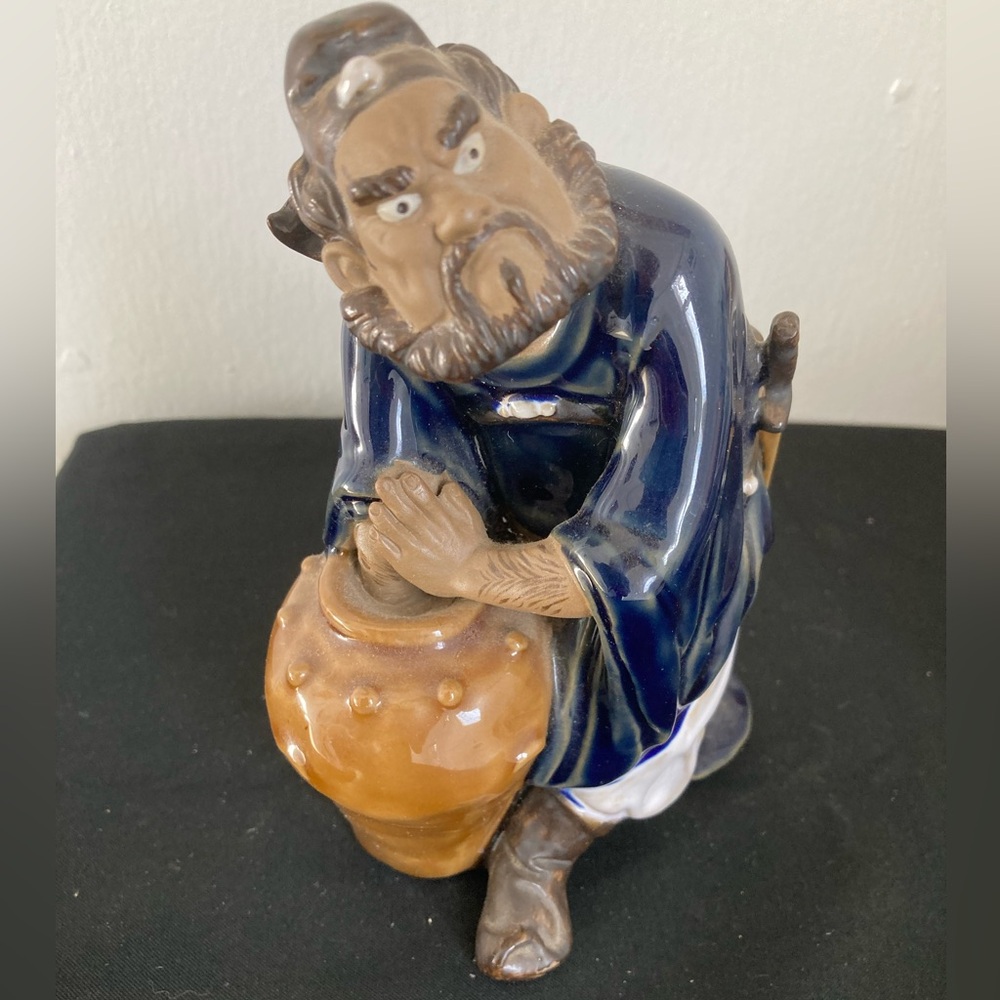 Ceramic “Mud Man” Figurine with Blue and Brown Accents